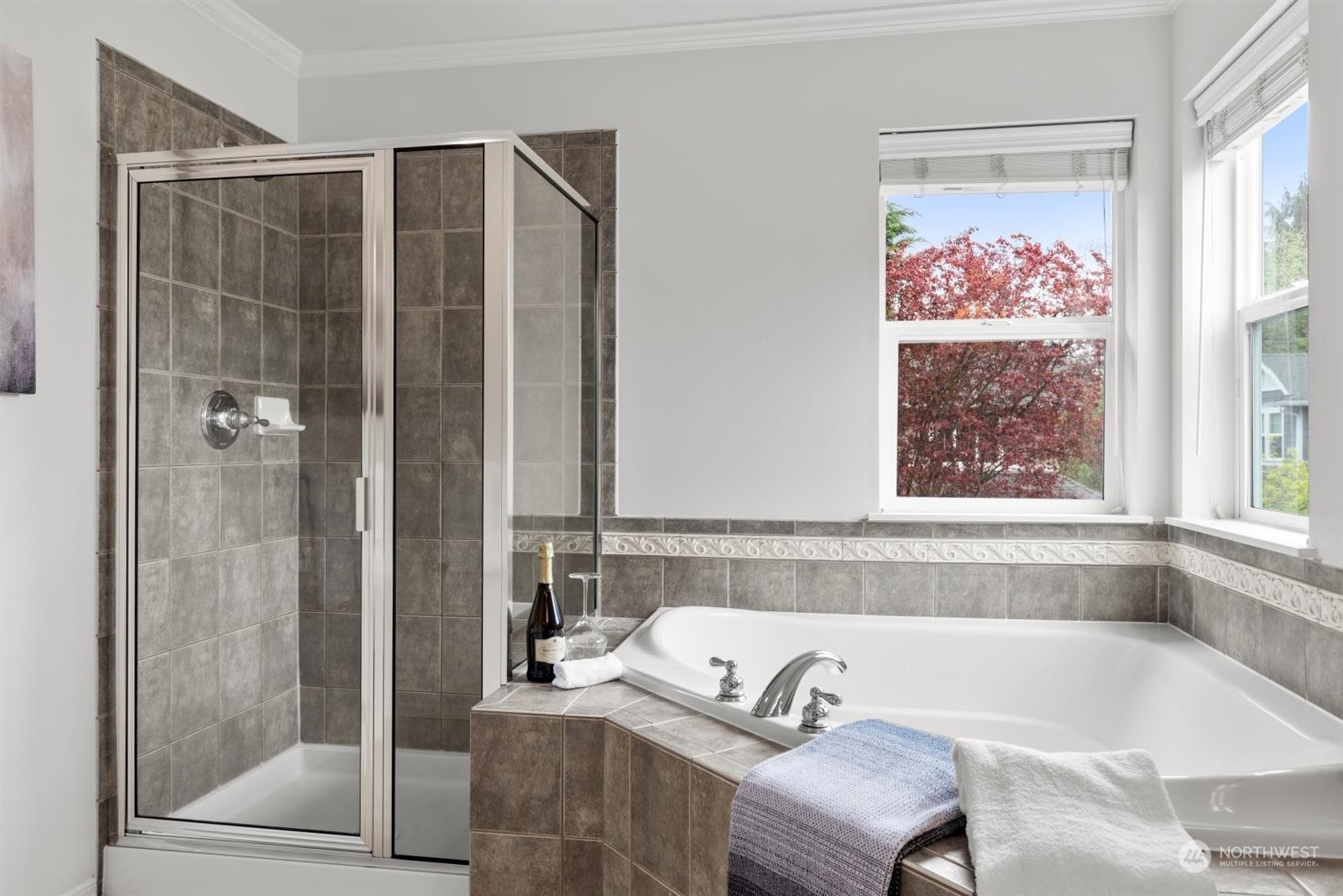 15929 36th Avenue Southeast Bothell, WA 98012 - Photo 18 of 33 a bathroom with a tub and a shower