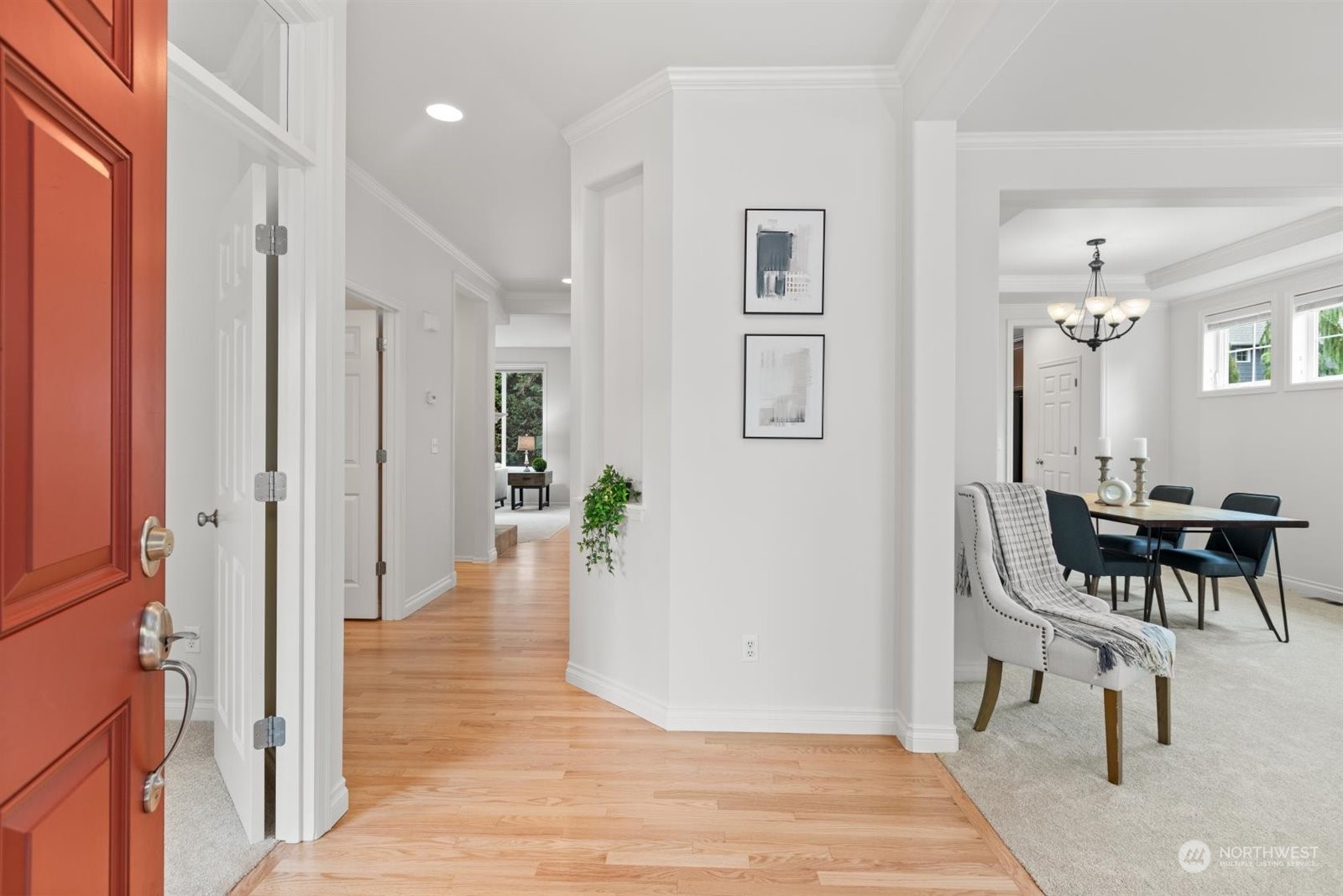 15929 36th Avenue Southeast Bothell, WA 98012 - Photo 2 of 33 a view of a hallway with dining area windows and wooden floor