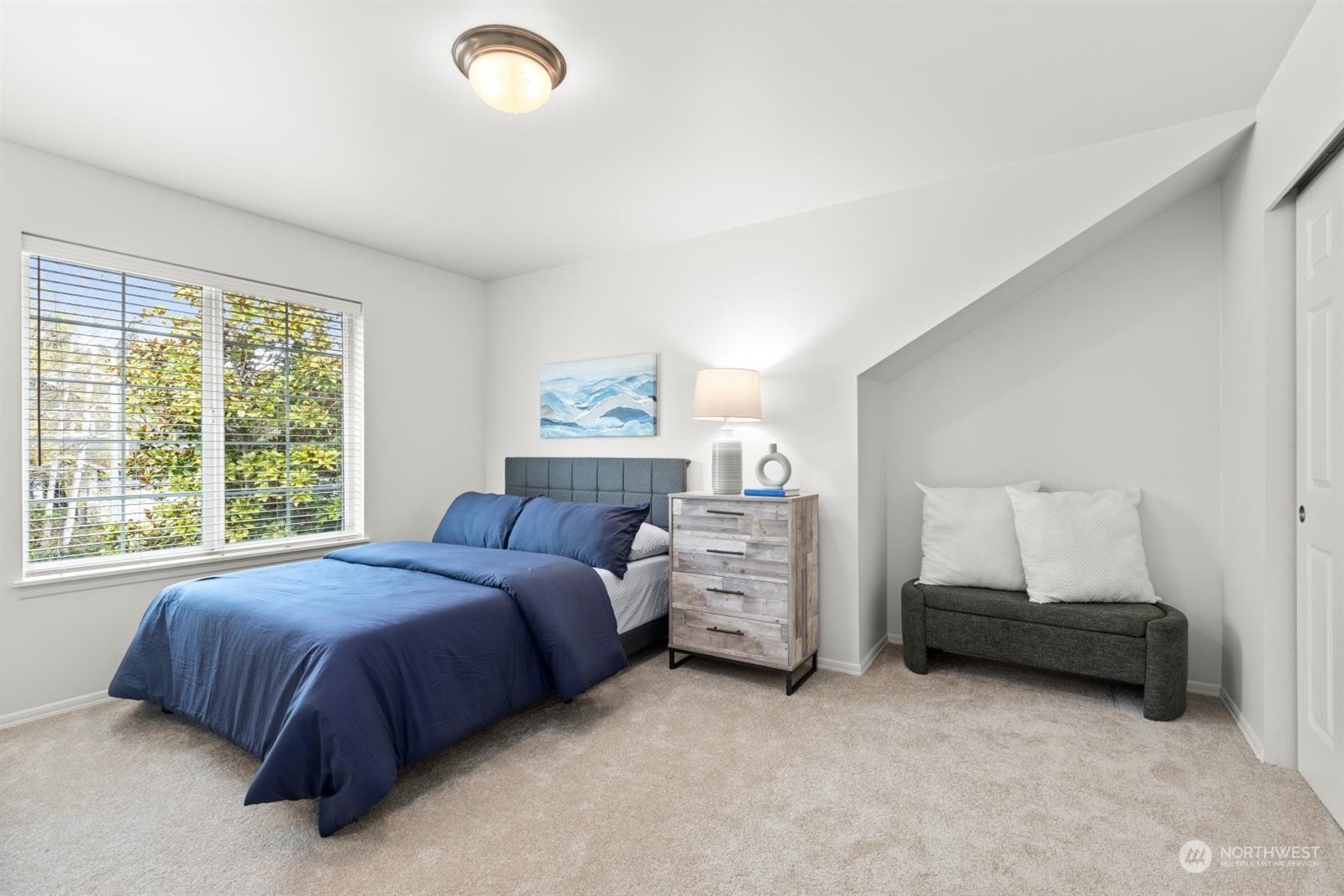 15929 36th Avenue Southeast Bothell, WA 98012 - Photo 24 of 33 a spacious bedroom with a bed and a window
