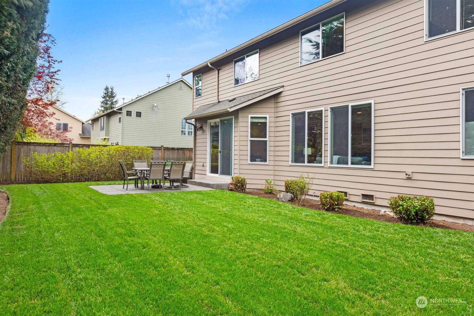 15929 36th Avenue Southeast Bothell, WA 98012 - Photo 30 of 33 a backyard of a house with table and chairs