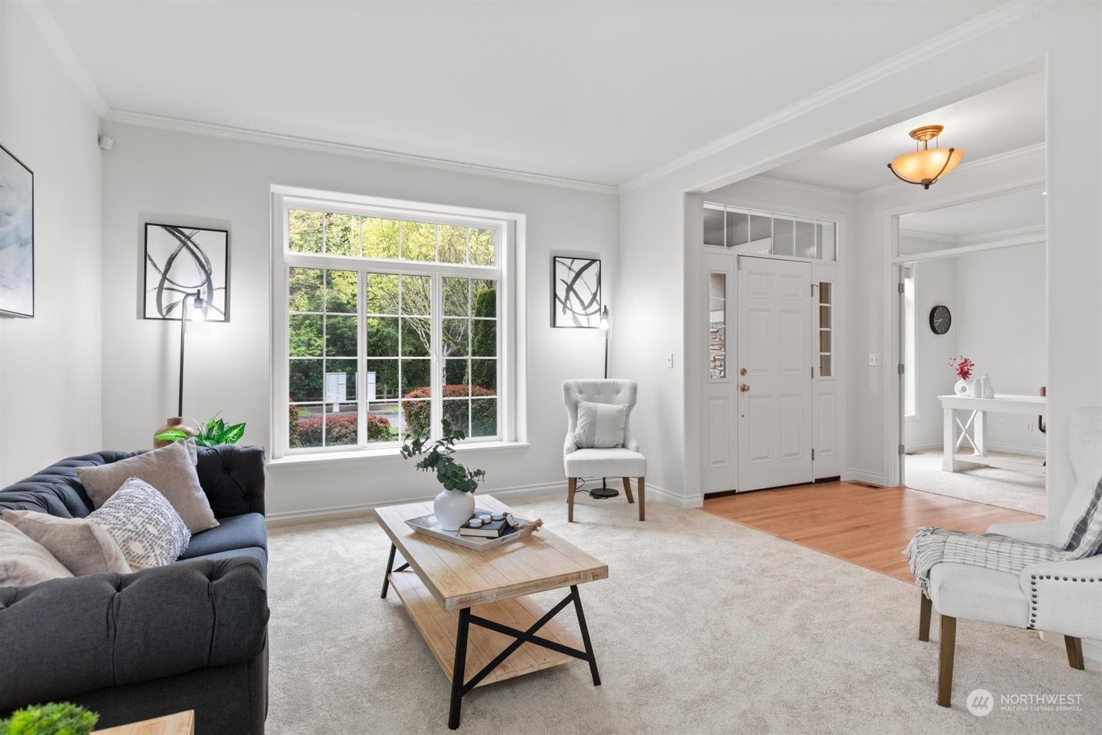 15929 36th Avenue Southeast Bothell, WA 98012 - Photo 3 of 33 a living room with furniture and a large window
