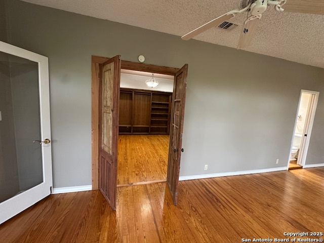 148 Robindale West Road Bandera, TX 78003 - Photo 16 of 24 an empty room with wooden floor and entrance