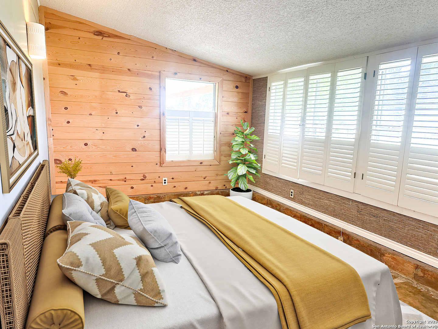 148 Robindale West Road Bandera, TX 78003 - Photo 18 of 24 a spacious bedroom with a bed and a large window