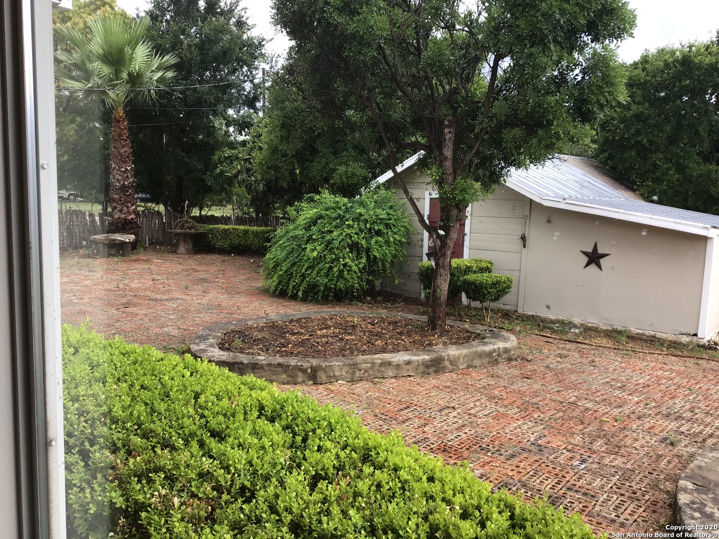 148 Robindale West Road Bandera, TX 78003 - Photo 2 of 24 a backyard of a house with lots of green space