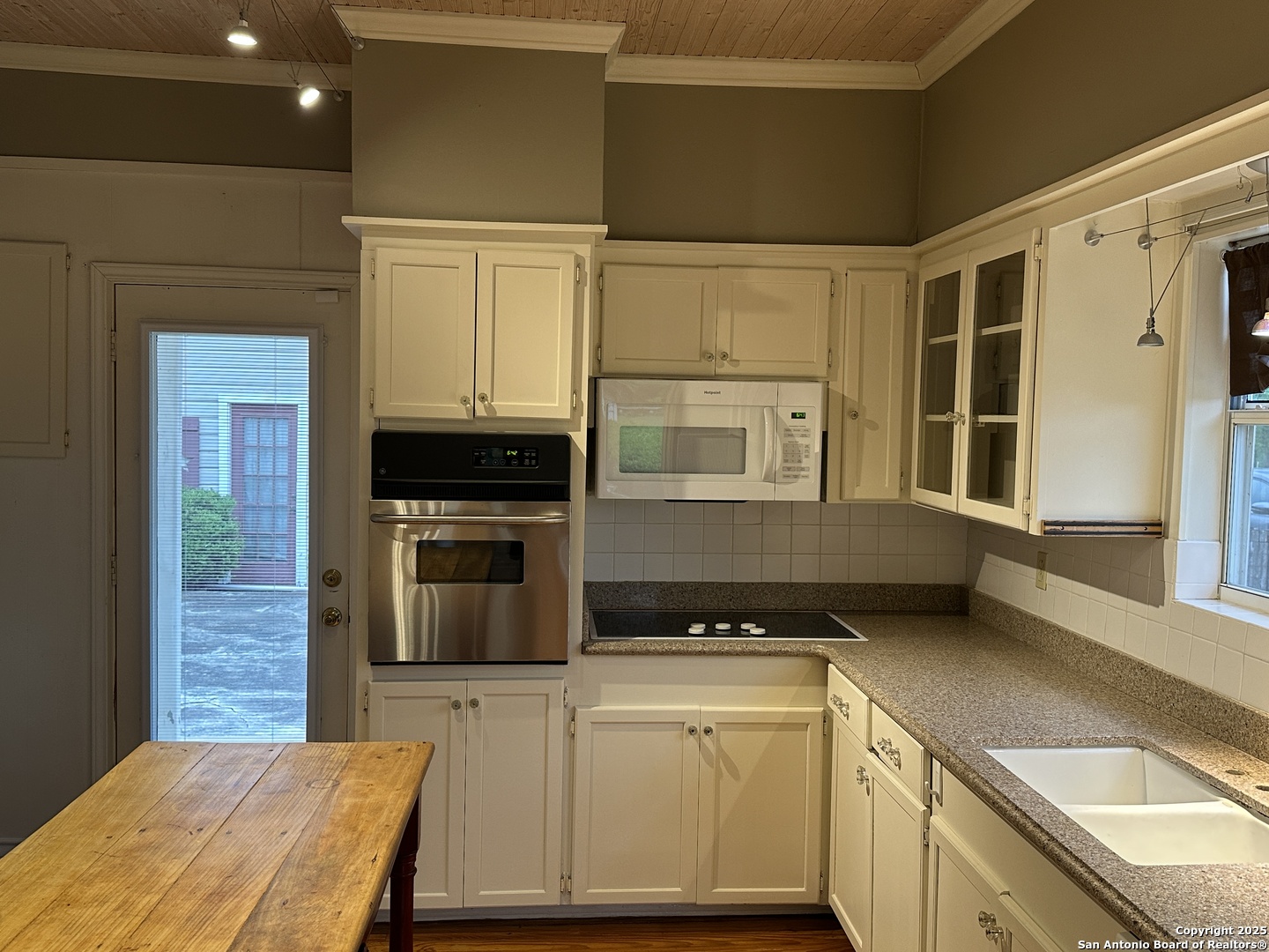 148 Robindale West Road Bandera, TX 78003 - Photo 7 of 24 a kitchen with granite countertop cabinets stainless steel appliances and a counter space
