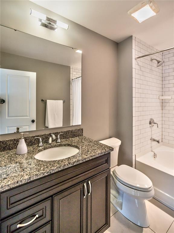 817 Mt Pleasant Road Mars, PA 16046 - Photo 22 of 25 The fourth bedroom's ensuite with a granite vanity and an oversized soaking tub accented with a subway tile surround.