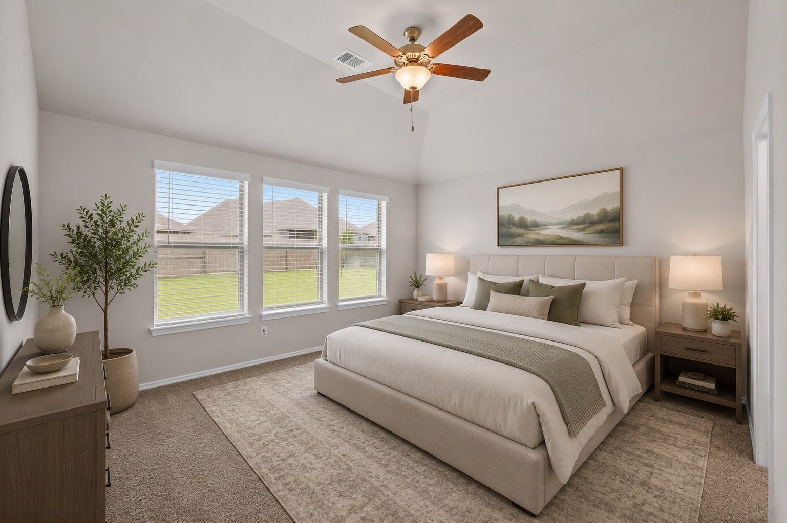 2011 Oak Leaf Court Manvel, TX 77578 - Photo 16 of 28 This is a bright, spacious bedroom featuring a large bed, neutral decor, and a ceiling fan. Natural light streams in through three windows, offering a view of the outdoors. The room is complemented by a soft carpet and tasteful furnishings.
