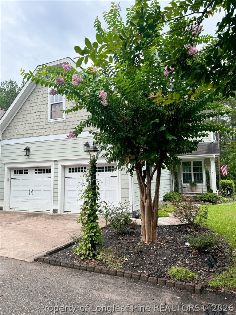 93 Falcon Ridge Drive Spring Lake, NC 28390 - Photo 4 of 50 a front view of a house with garden