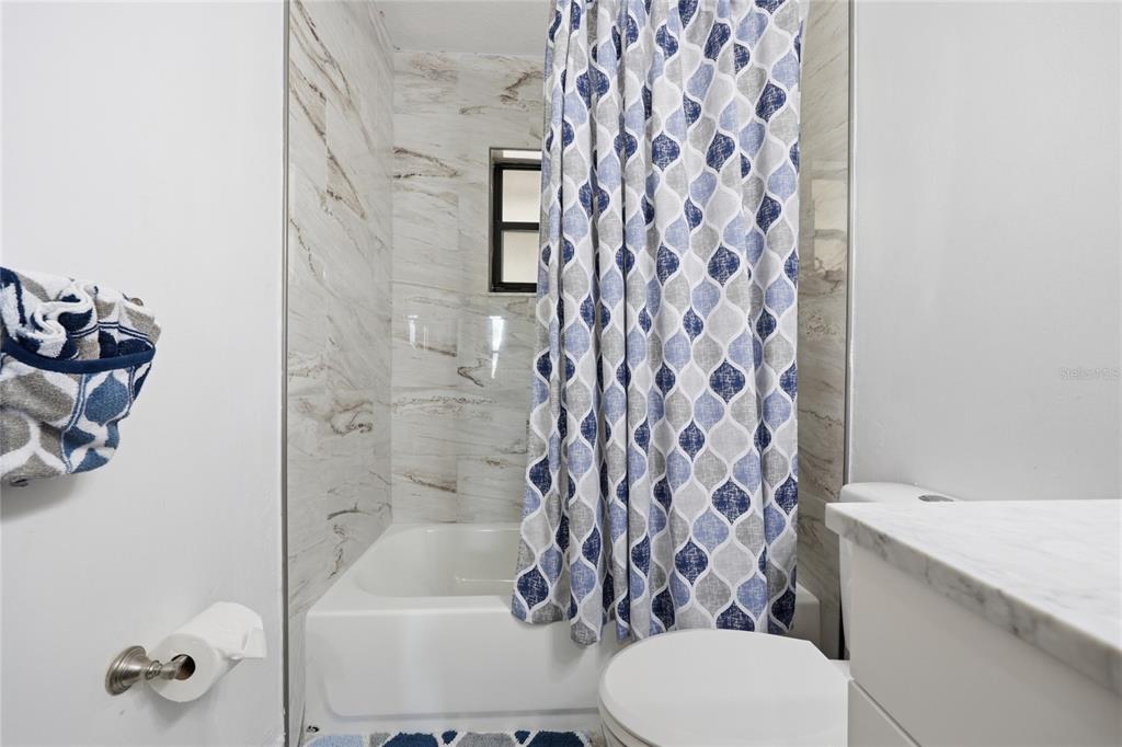 16104 Southwest 48th Circle Ocala, FL 34473 - Photo 23 of 34 a bathroom with a bathtub and shower