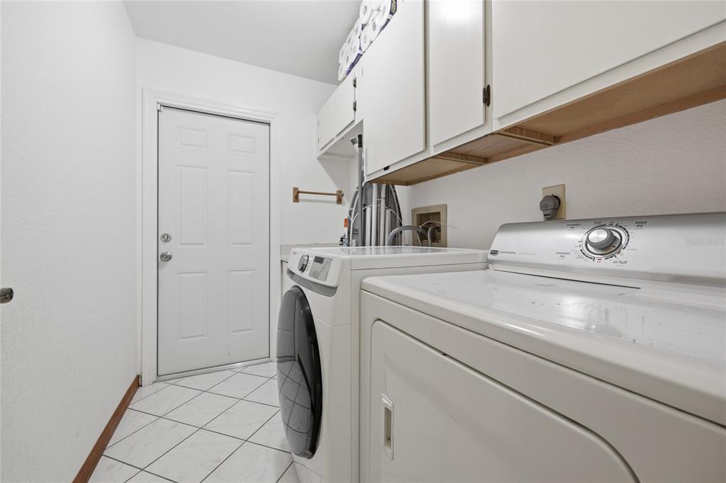 16104 Southwest 48th Circle Ocala, FL 34473 - Photo 30 of 34 a utility room with dryer and washer