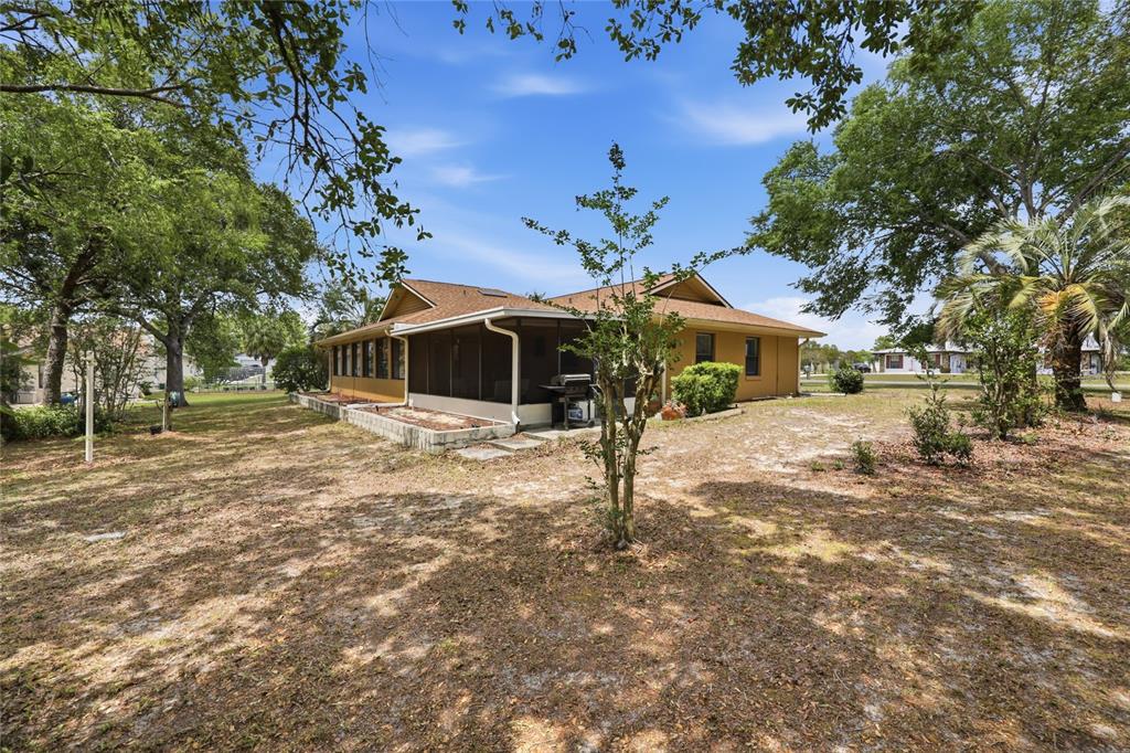 16104 Southwest 48th Circle Ocala, FL 34473 - Photo 34 of 34 a front view of a house with garden