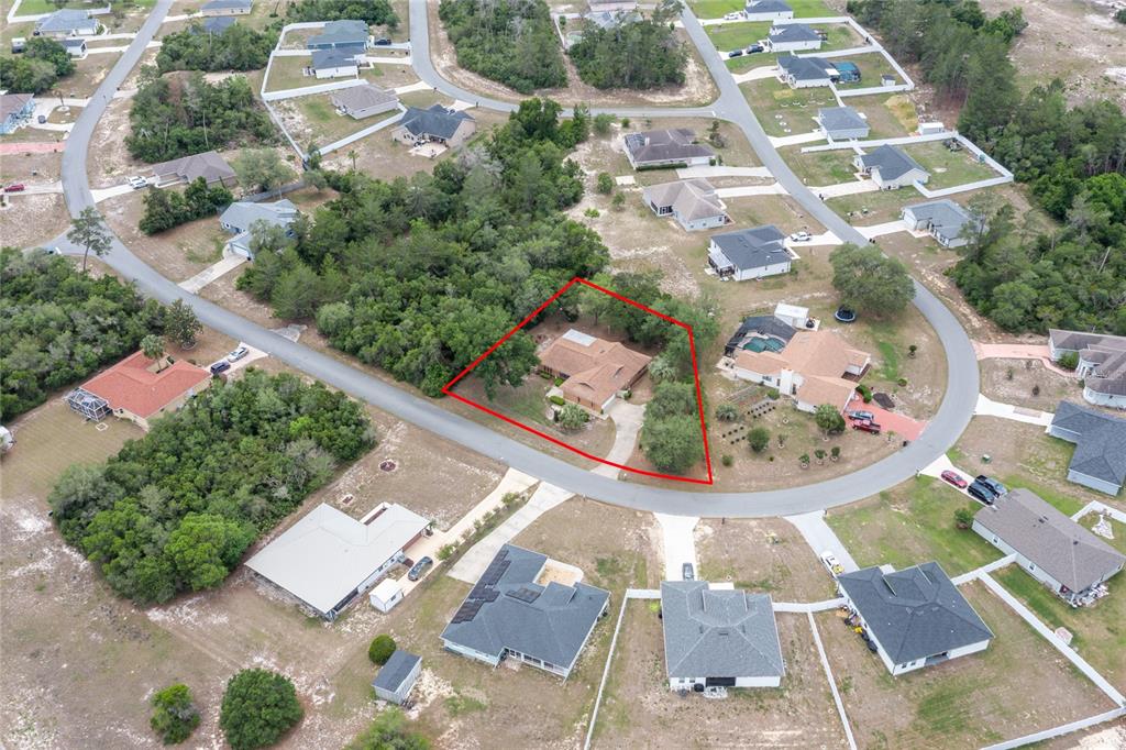 16104 Southwest 48th Circle Ocala, FL 34473 - Photo 4 of 34 an aerial view of residential houses with outdoor space