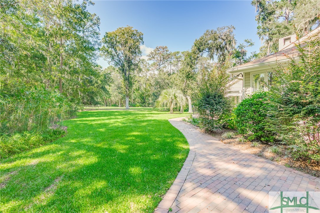 205 Bartram Road Savannah, GA 31411 - Photo 39 of 43 Paver walk way along the side of the home is accen