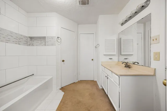 a bathroom with a sink and a bathtub