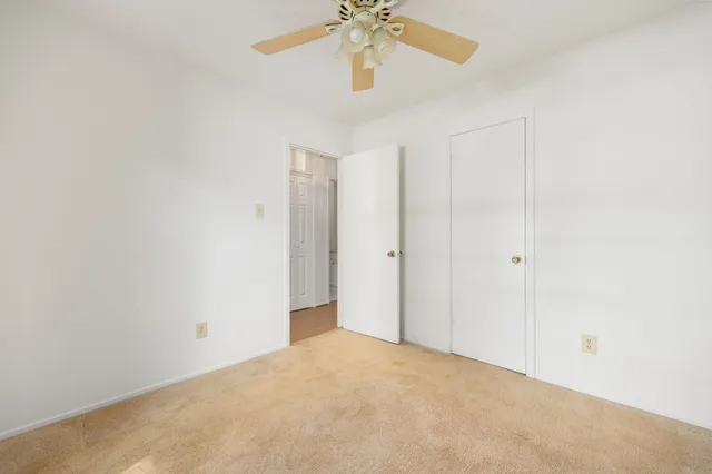 a view of a chandelier fan in a room
