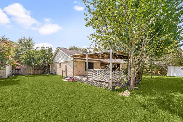 an aerial view of a pool and chairs