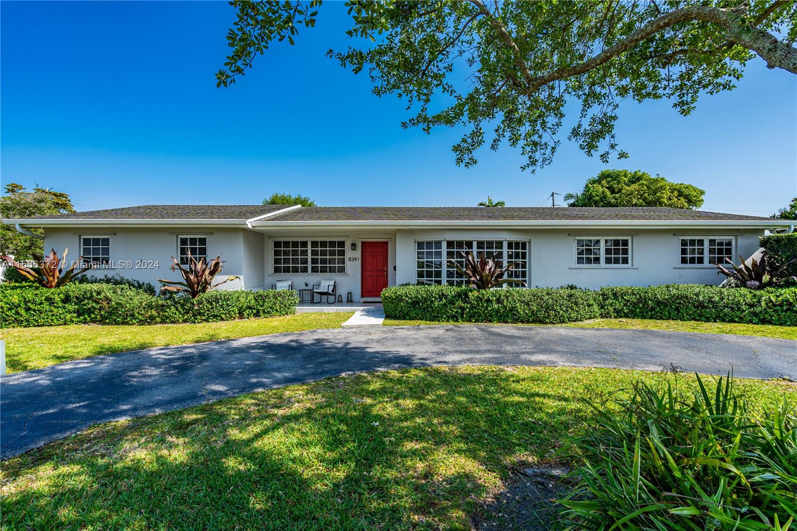 8341 Southwest 87th Terrace Miami, FL 33143 - Photo 1 of 31 a front view of house with yard and green space