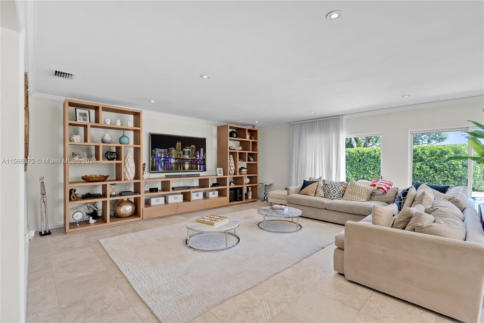 8341 Southwest 87th Terrace Miami, FL 33143 - Photo 11 of 31 a living room with furniture and a large window