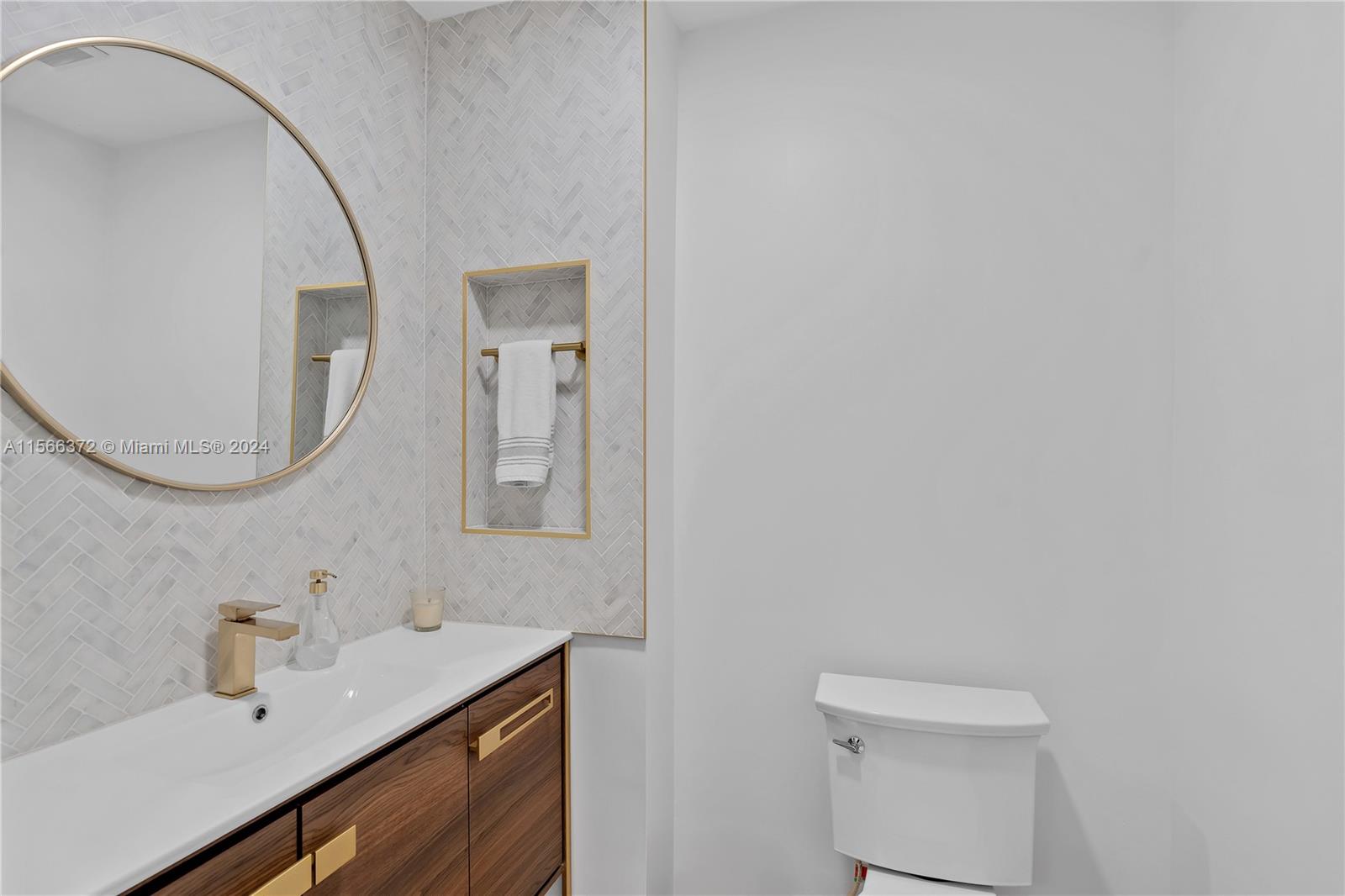 8341 Southwest 87th Terrace Miami, FL 33143 - Photo 14 of 31 a bathroom with a sink vanity and a mirror