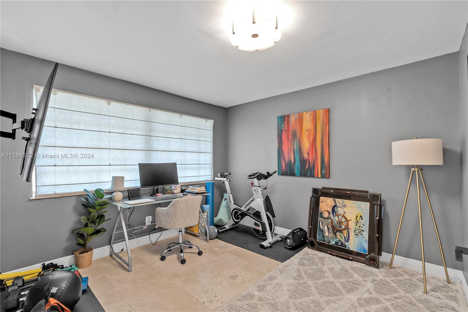8341 Southwest 87th Terrace Miami, FL 33143 - Photo 18 of 31 a room with gym equipment and a window