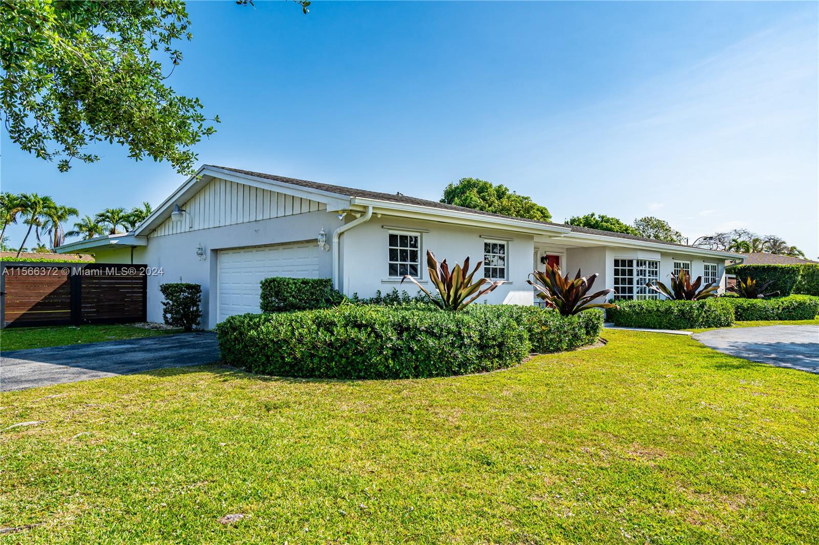 8341 Southwest 87th Terrace Miami, FL 33143 - Photo 2 of 31 a front view of house with yard and green space