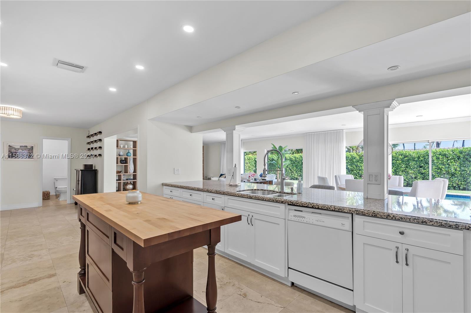8341 Southwest 87th Terrace Miami, FL 33143 - Photo 8 of 31 a kitchen with sink and refrigerator