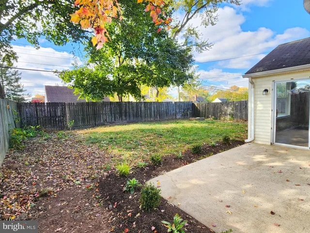 a view of a backyard with a small cabin