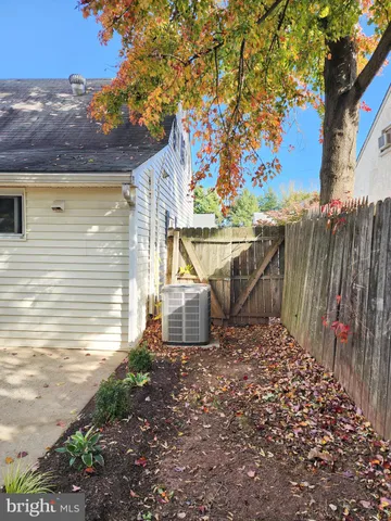 a view of a house with a tree in the background