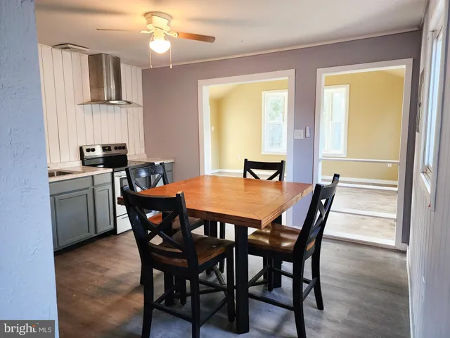 a view of a dining room with furniture and window