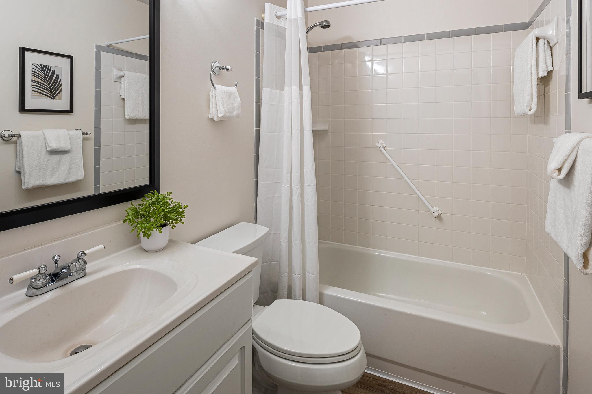 982 Fall Cir Way Gambrills, MD 21054 - Photo 14 of 32 a bathroom with a granite countertop sink toilet and shower