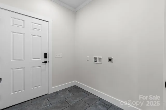 a view of a garage with rack and bicycle
