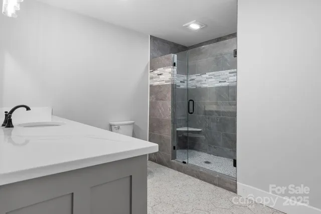 a view of a room with wooden floor and couch