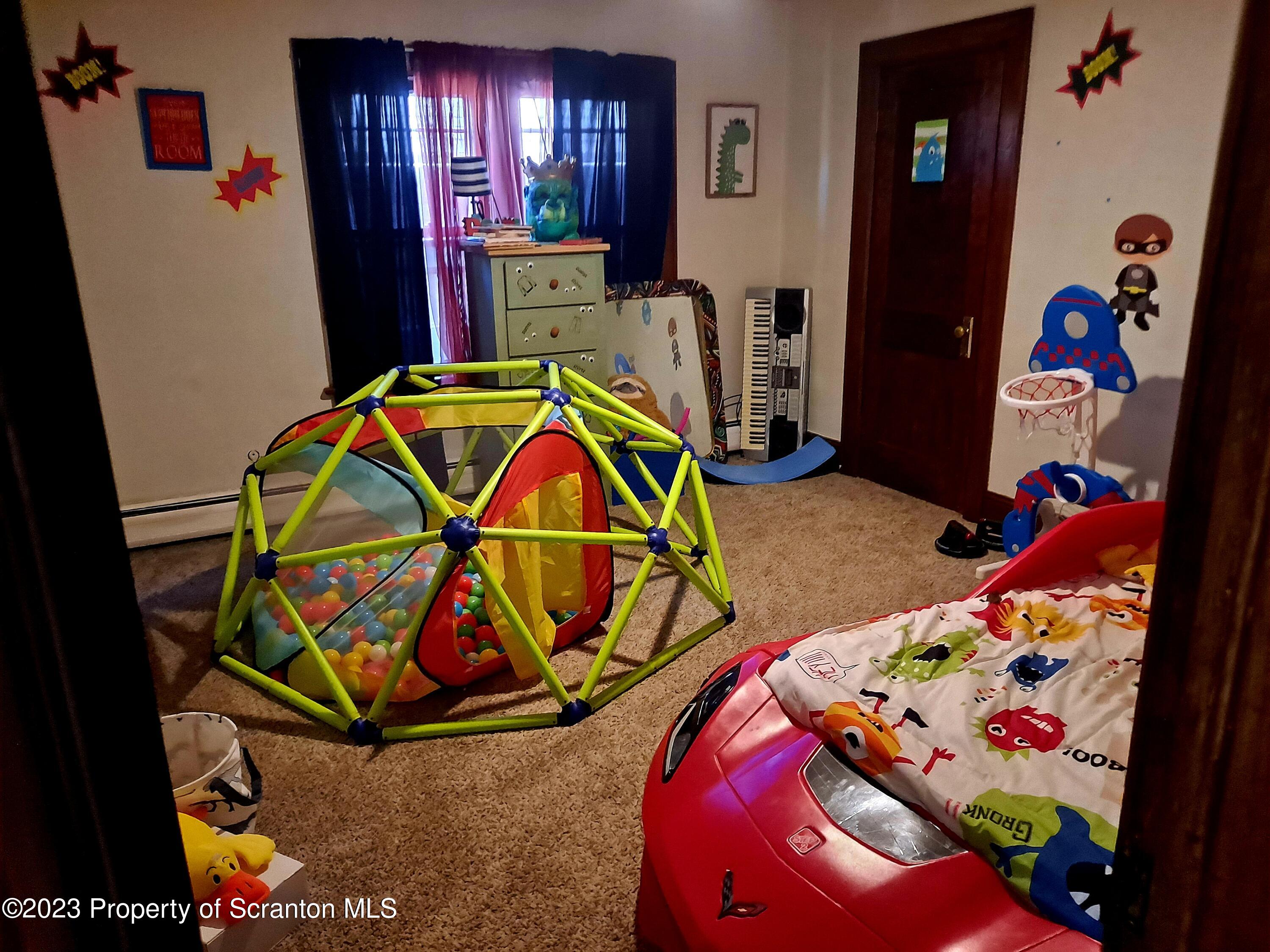 231 Putnam Street Scranton, PA 18508 - Photo 11 of 13 kids room with toys and wooden floor