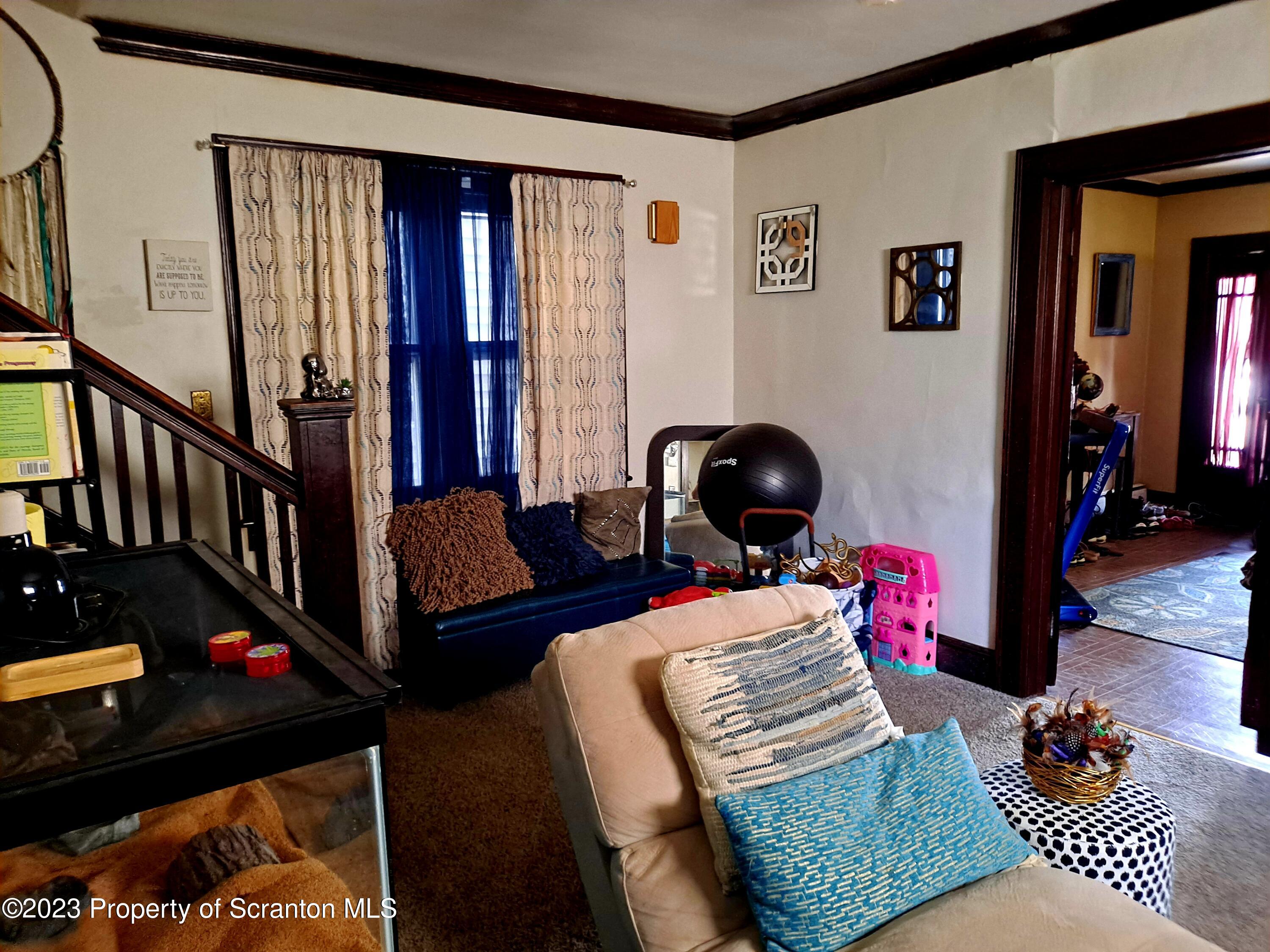 231 Putnam Street Scranton, PA 18508 - Photo 4 of 13 a living room with furniture and wooden floor