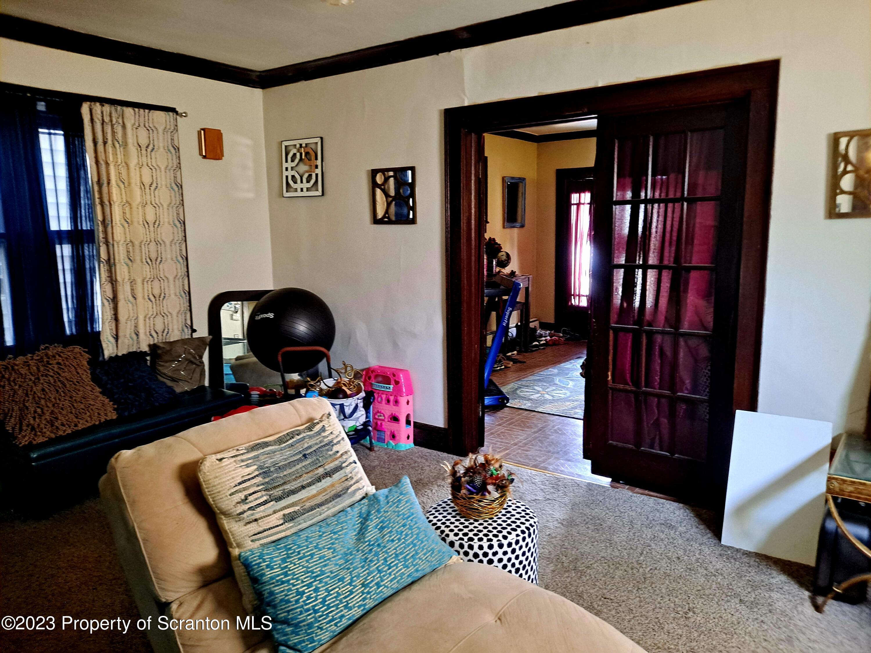 231 Putnam Street Scranton, PA 18508 - Photo 5 of 13 a bedroom with furniture and a window