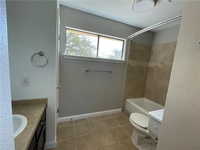 a bathroom with a sink double vanity and a mirror