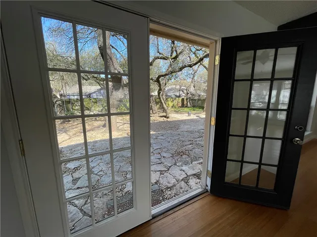 a view of a door and chair and door