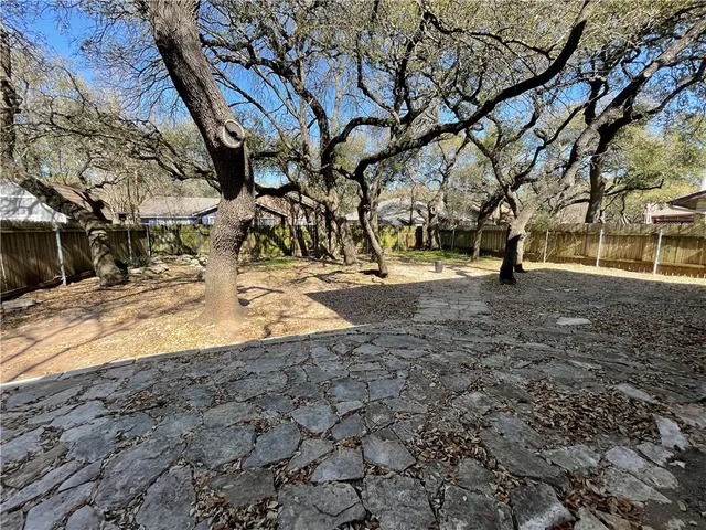 a view of house with outdoor space and sitting area