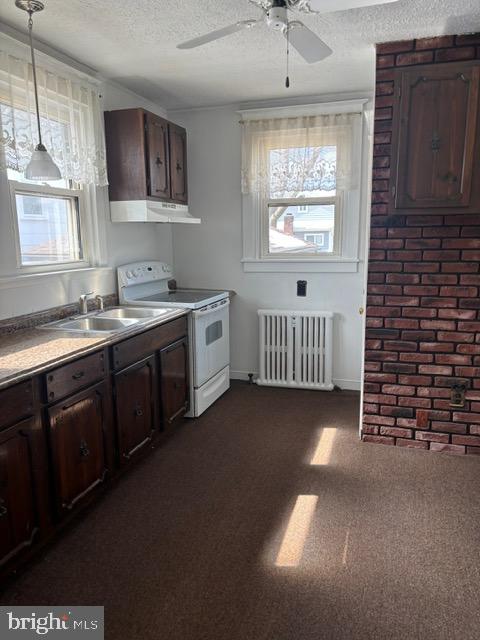 257 Newportville Road Croydon, PA 19021 - Photo 16 of 21 a kitchen that has a sink and a stove