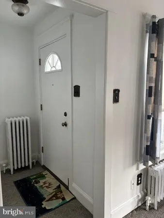 a view of kitchen appliances and cabinets