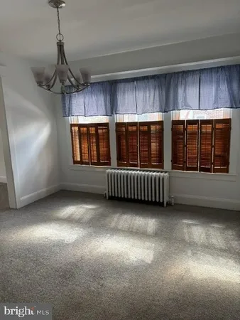 a view of a livingroom with furniture and window