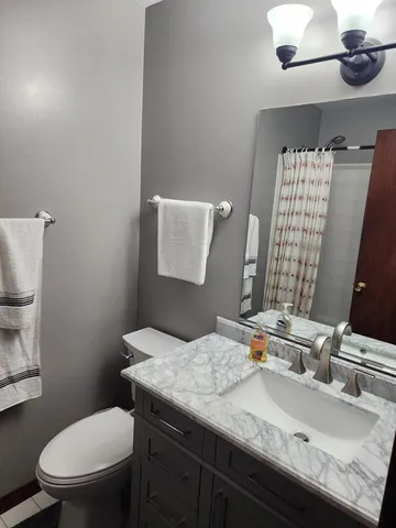 a bathroom with a shower and a bath tub