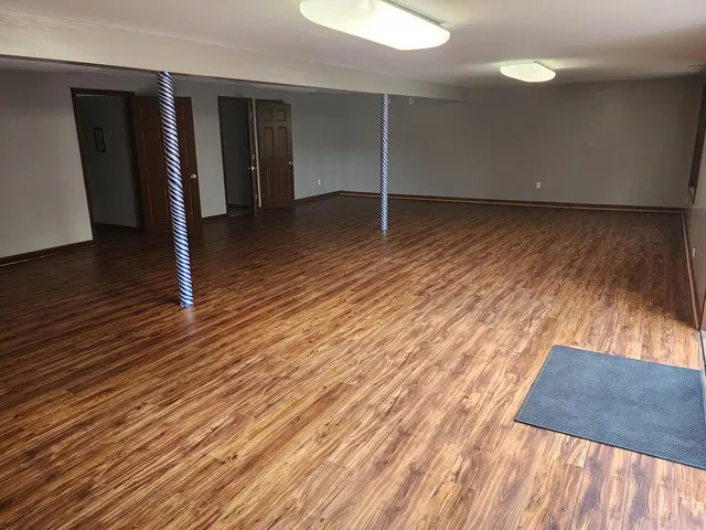 a balcony with wooden floor