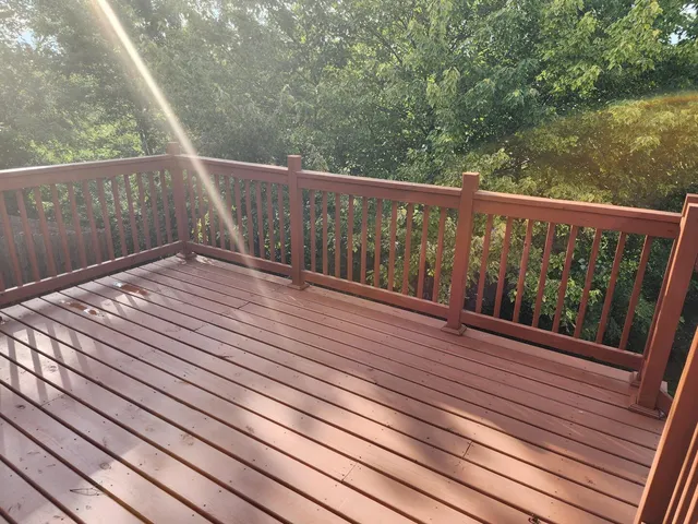 a view of balcony with wooden floor