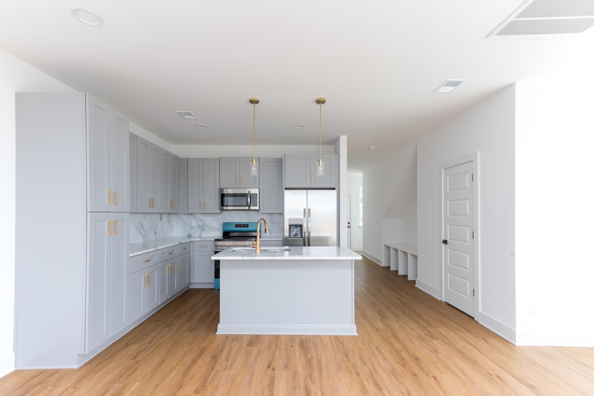 113 High Pk Circle Lebanon, TN 37087 - Photo 2 of 20 a kitchen with stainless steel appliances granite countertop a white cabinets and wooden floors