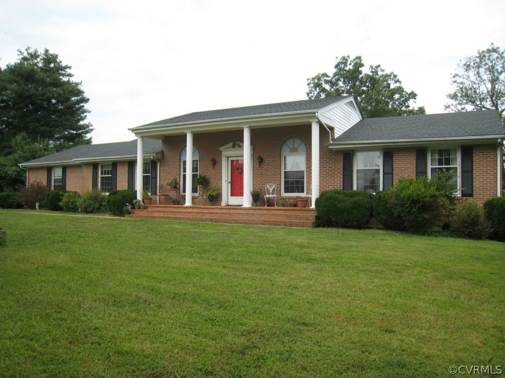 9855 Red House Road Red House, VA 23963 - Photo 1 of 24 a front view of a house with a yard