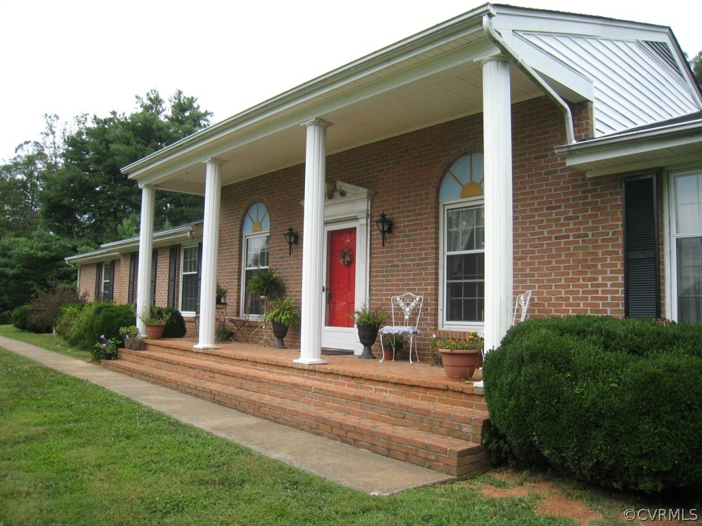9855 Red House Road Red House, VA 23963 - Photo 10 of 24 a front view of a house with a yard