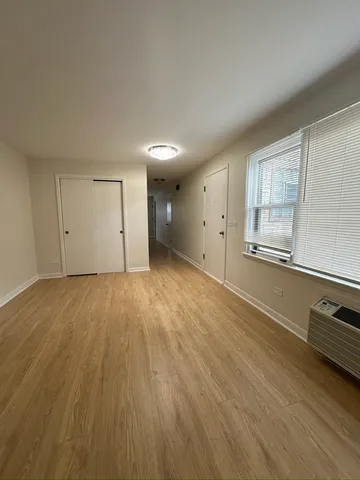 a view of an empty room and a window