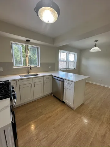 a large kitchen with a large window