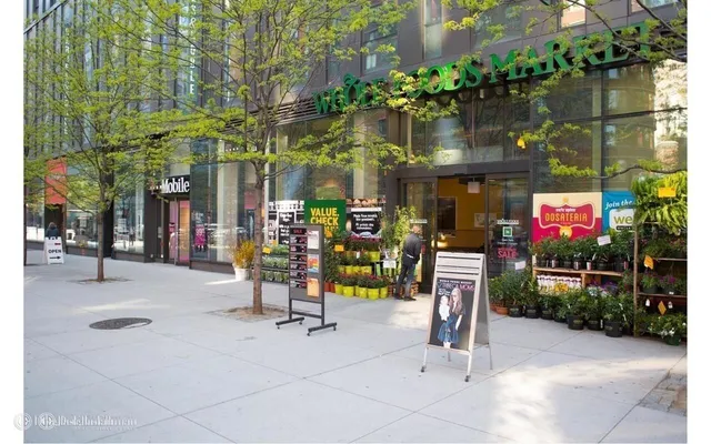 a view of path along with retail shop and buildings